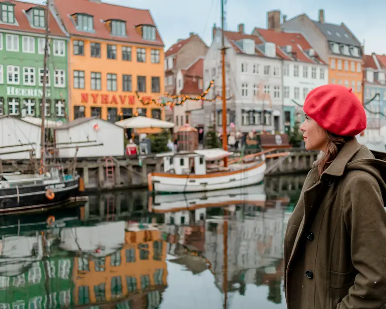 me posing in front of the homes of Nyhavn one of the top Copenhagen photo spots