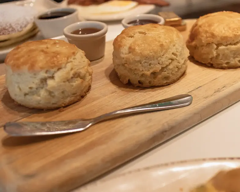 cutting board with 3-biscuits at Overeasy