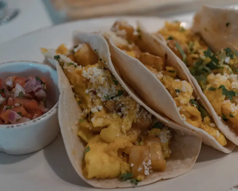 Breakfast tacos on plate at Overeasy
