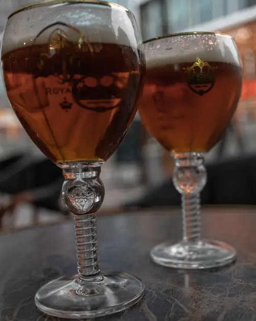 Two Belgian beers on a table at La Lunette. 