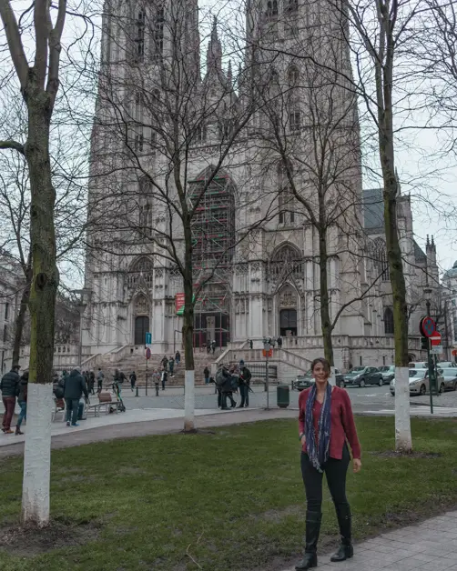 Me standing in front of The Cathedral of St. Micheal and St. Gudula one of the must-see places during a layover in Brussels