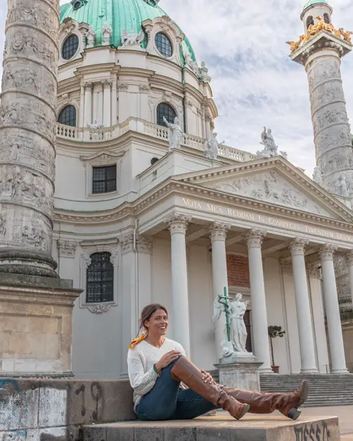Me sitting and posing on a step in front of Karlskirche