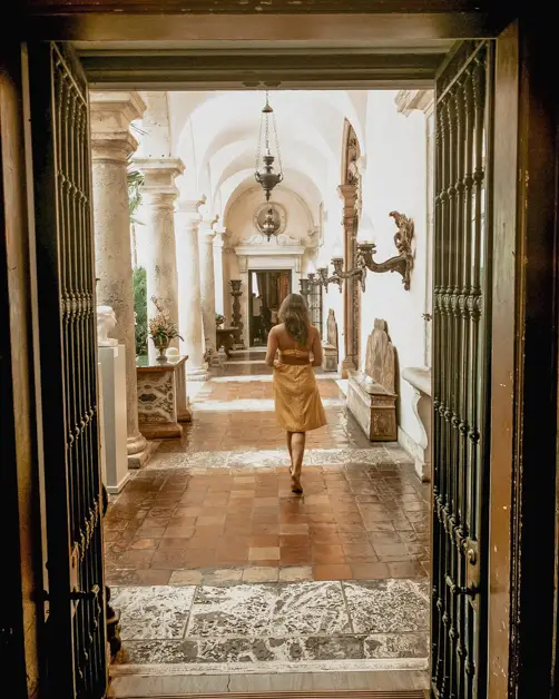 Me walking down a whimsical hallway at Vizcaya Museum
