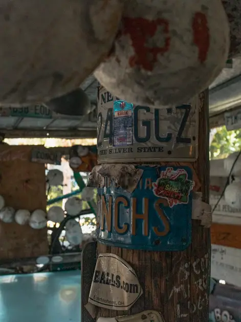 Inside of B.O.'s Fish Wagon columns with license plates. 