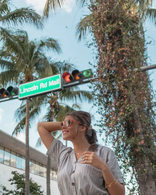 Picture of me in front of the Lincoln Road Mall sign. Shopping Lincoln Road is one of the many things to do in Miami Beach. 