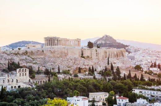 Things to do in Athens photo of the Acropolis during sunset.