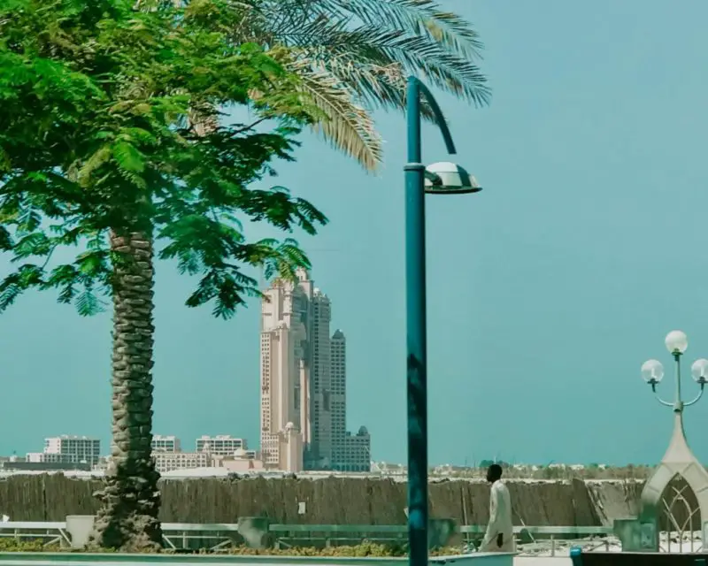 picture of Corniche Road with an Emirate walking