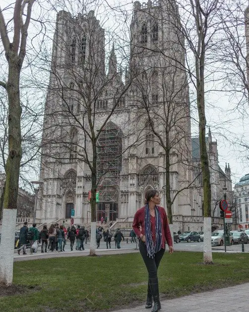 Me standing in front of The Cathedral of St. Michael and St. Gudula in Brussels an awesome solo female travel destination