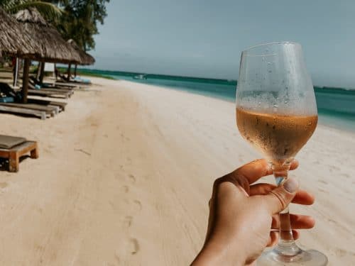 picture of a glass of rose at the beach in Mauritius