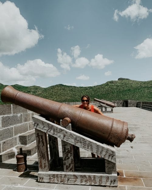 me posing with one of the canons at the fort in Port Louis