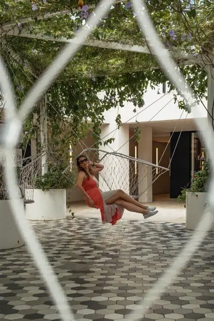 Me posing on a swing in Miami design district one of the best places to take pictures in Miami