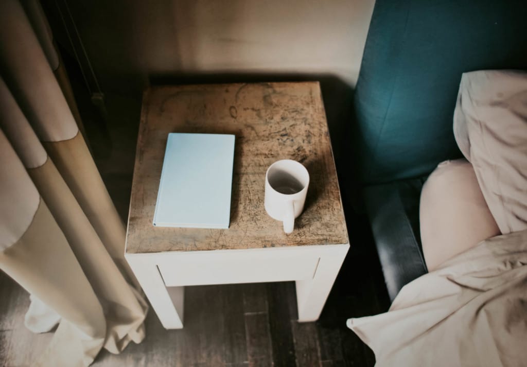 picture of a nightstand at a hotel