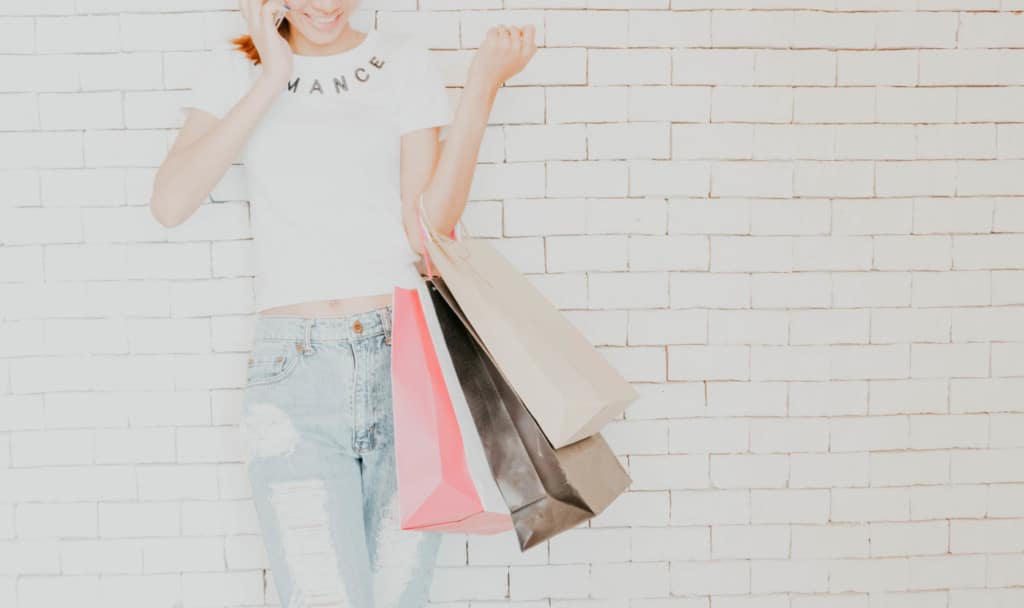 woman holding shopping bags