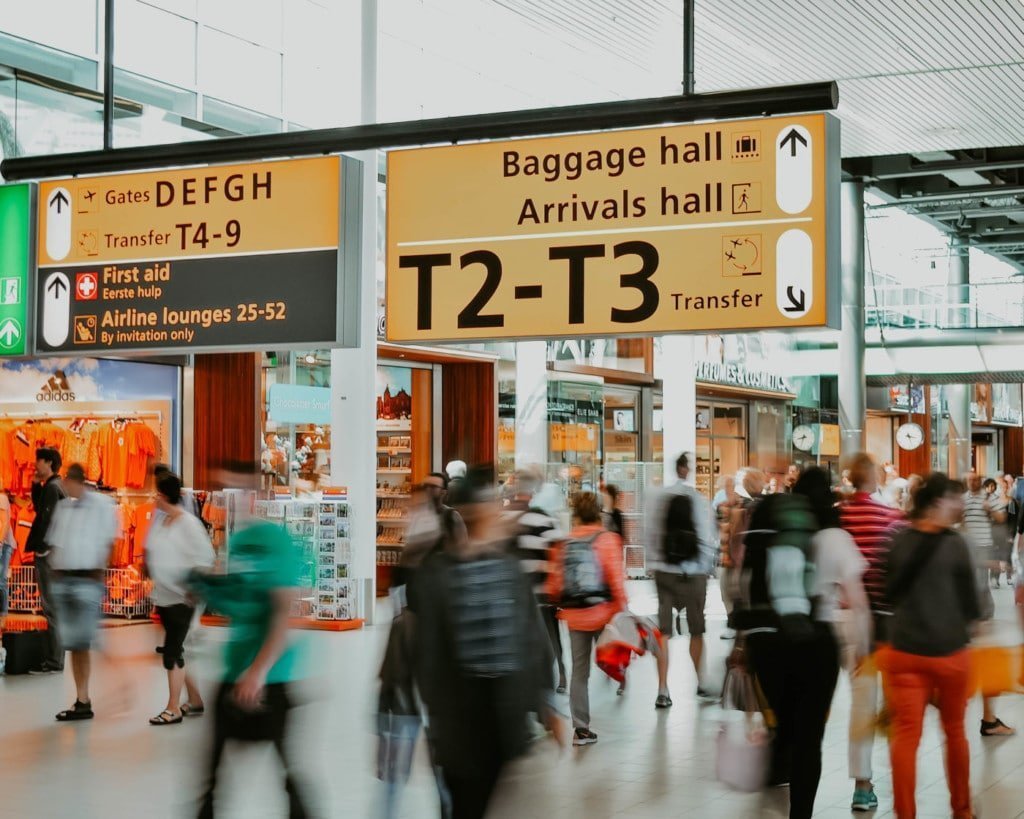 Picture of people walking inside a busy airport