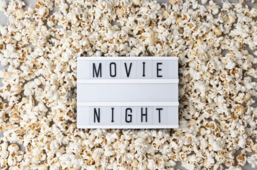 Travel movies photo of popcorn and sign that says movie night.