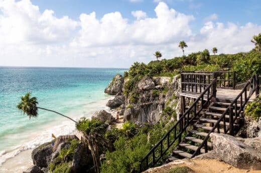 How to get to Tulum from Cancun photo of a beach in Tulum by the ruins.