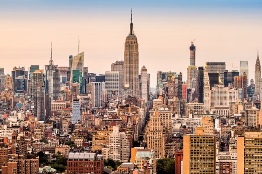 New York Instagram captions photo of an aerial view of NYC during sunset.