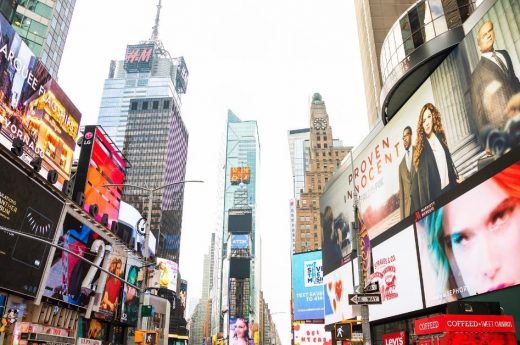 Times Square captions photo of Times Square in New York City.