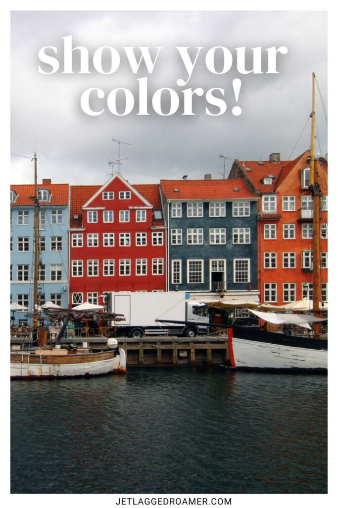 Copenhagen Instagram captions photo of Nyhavn  canal in Copenhagen, Denmark. Caption says "show your colors."