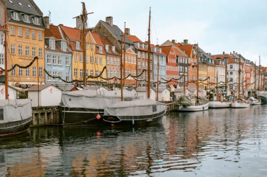 Posing at Nyhavn one of the most Instagrammable places in Copenhagen. One of the top Copenhagen photo spots.