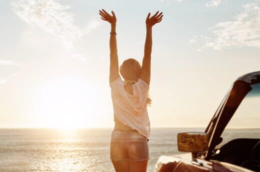 Adventure captions for Instagram photo of a woman at the beach in front of the water.