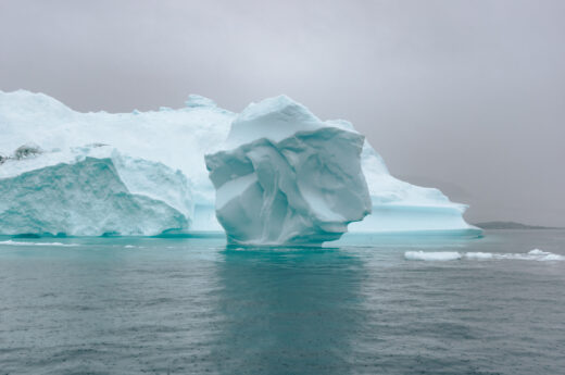 Off the beaten path travel photo of an iceberg in Greenland.