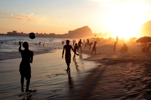 Brazil captions For Instagram photo of locals strolling Copacabana Beach in Rio de Janeiro, Brazil at dusk.