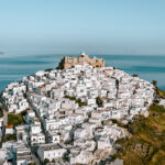 Drone view of the Astypalea castle and windmills one of the top things to do in Astypalea.