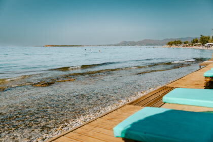 Beach in Agistri with sun beds. One of the best things to do in Agistri.