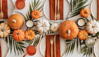 Thanksgiving captions photo of a beautifully decorated table for Thanksgiving.