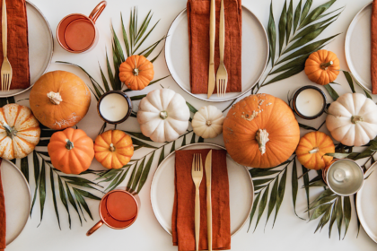 Thanksgiving captions photo of a beautifully decorated table for Thanksgiving.