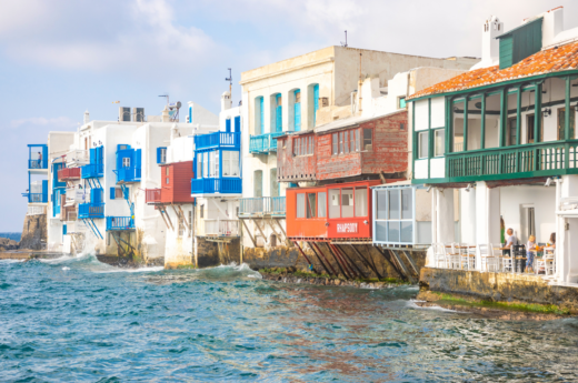 Mykonos captions photos of Mykons and colorful houses.