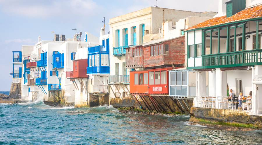 Mykonos captions photos of Mykons and colorful houses.